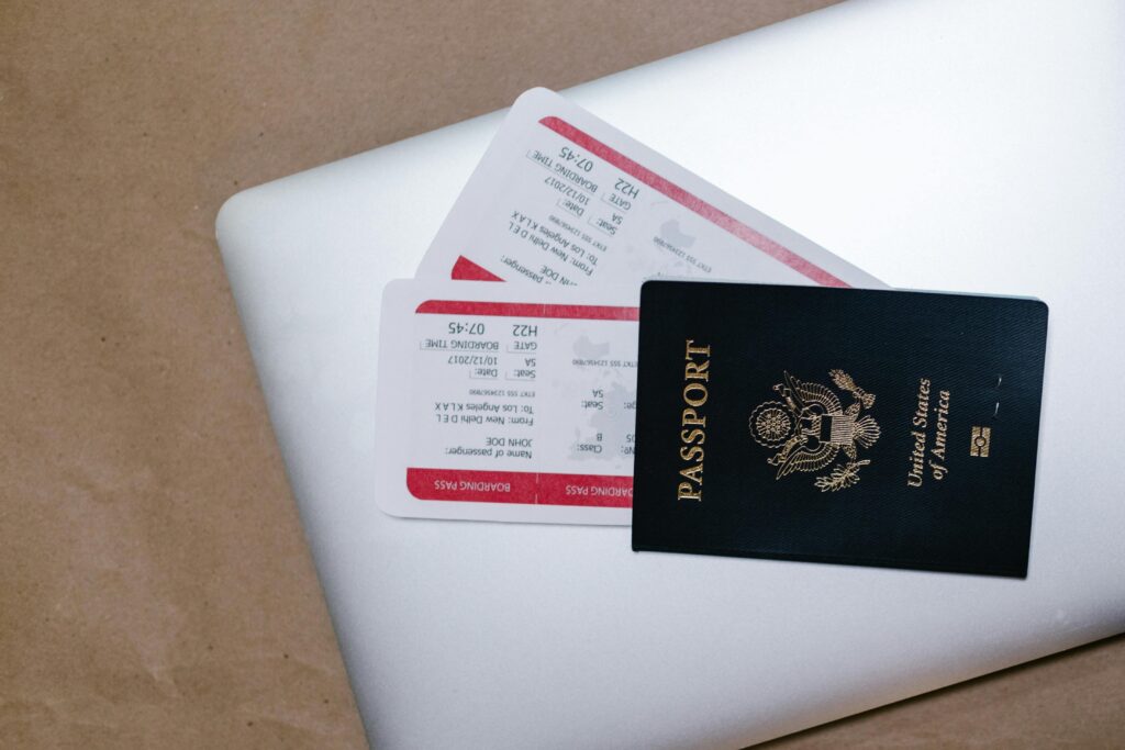 Passport and airline boarding passes for a trip to Belize, symbolizing travel preparation and entry requirements.